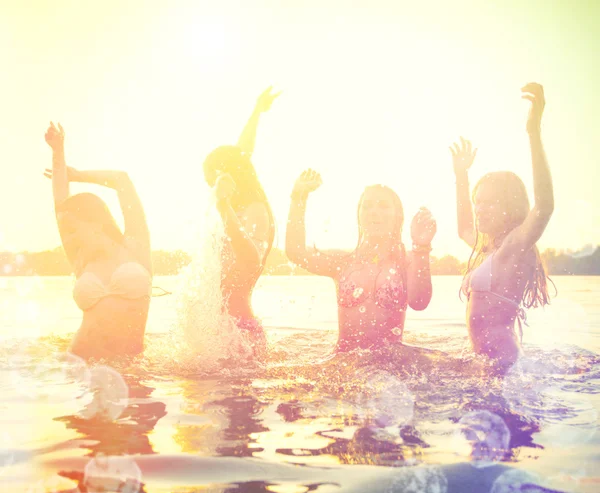 Girls playing at the beach