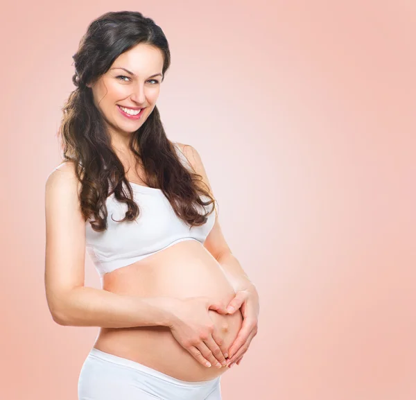Pregnant woman holding her  belly — Stock Photo, Image