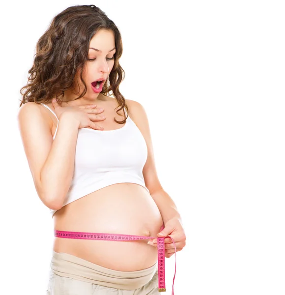 Pregnant  woman measuring  pregnant belly — Stock Photo, Image