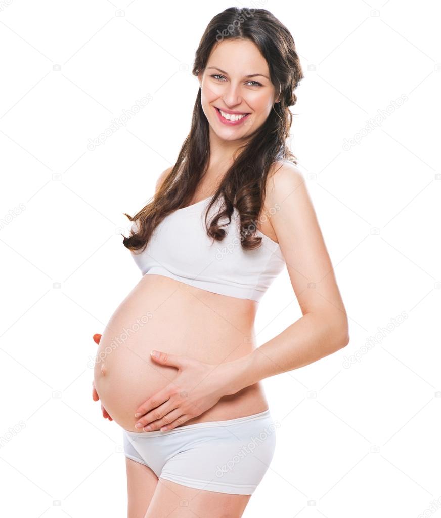 pregnant woman touching her belly.