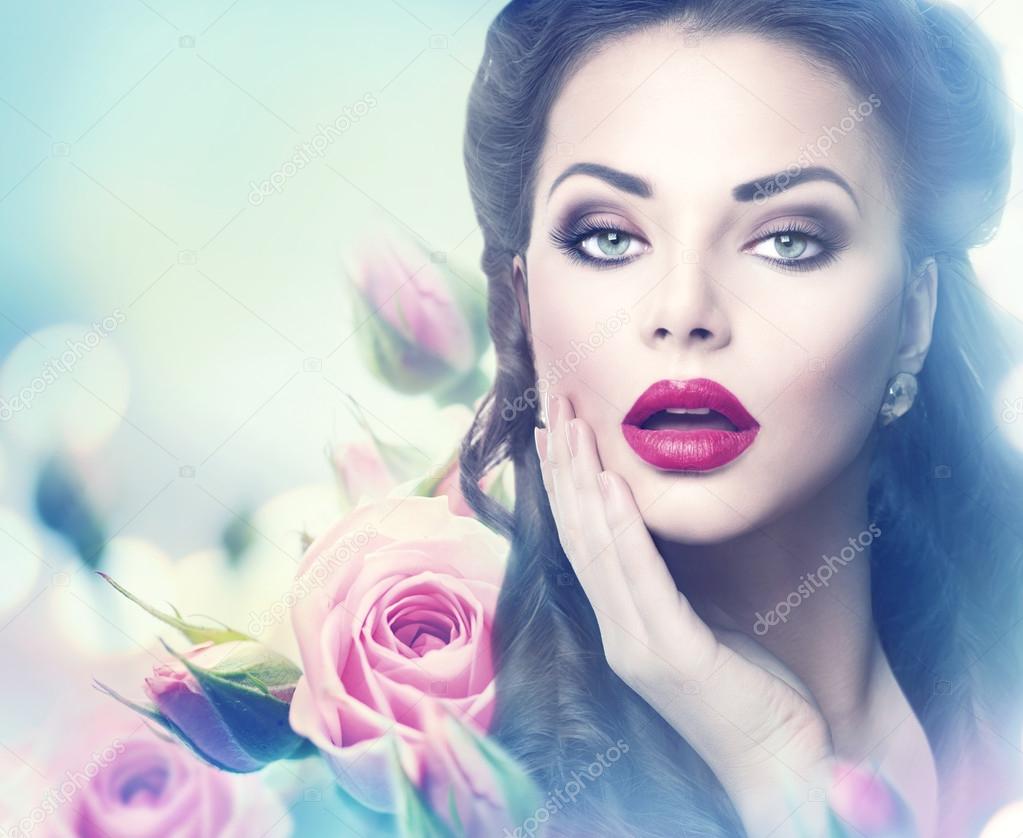 Retro woman portrait in pink roses.