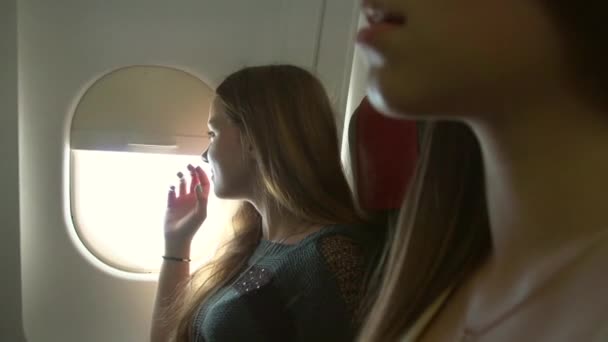 Young women traveling by plane — Stock Video