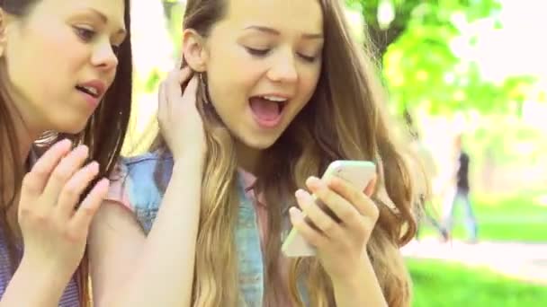 Teen girls taking photos with  smartphone — Stock Video