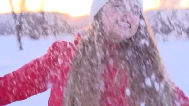 Teenage girl throws snow up — Stock Video