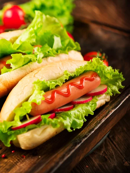 Grilled hot dogs with mustard and ketchup — Stock Photo, Image