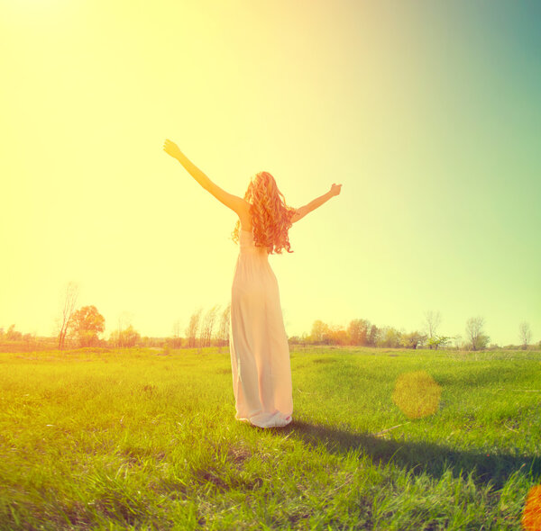 girl enjoying nature on field