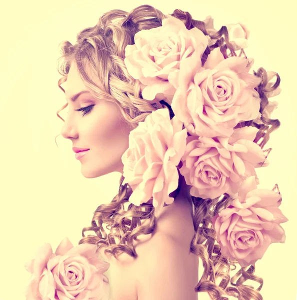 Girl with rose flowers in hairstyle — Stock Photo, Image