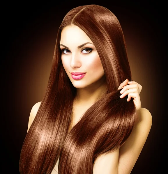 Woman touching her straight hair — Stock Photo, Image