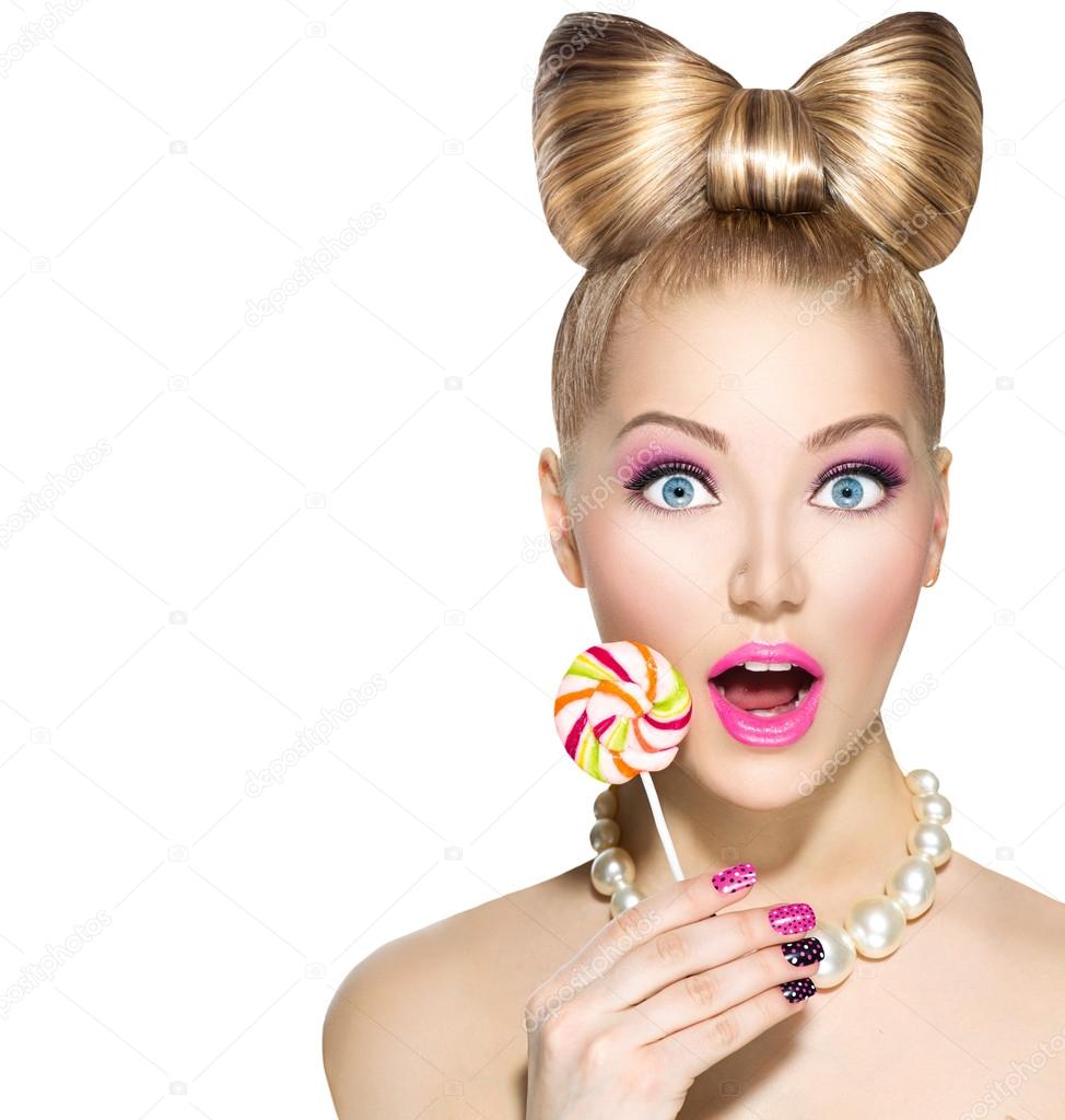 girl  eating colorful lollipop