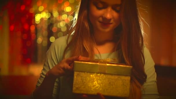 Girl opens Christmas gift box — Stock Video