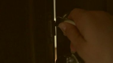 Woman's hand open  door