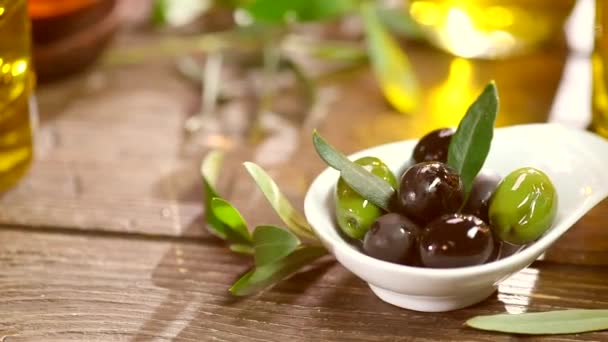 Olives and pouring olive oil. — Stock Video