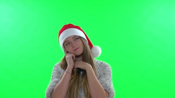 Beautiful teenage girl in santa hat — Stock Video
