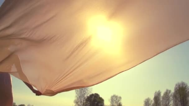 Girl  running on field to sunset — Stock Video