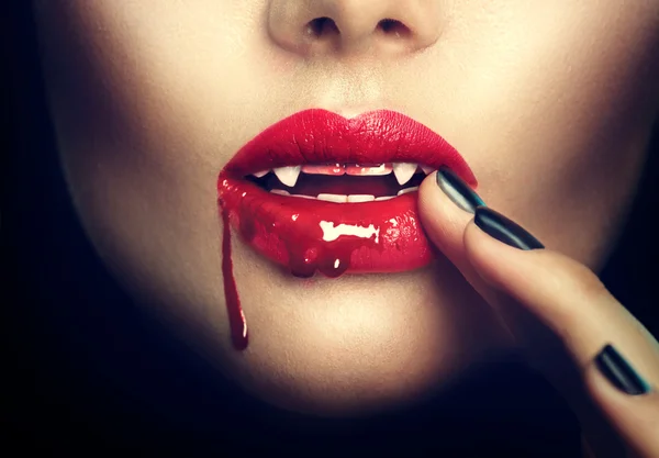 Sexy vampire woman lips with blood — Stock Photo, Image