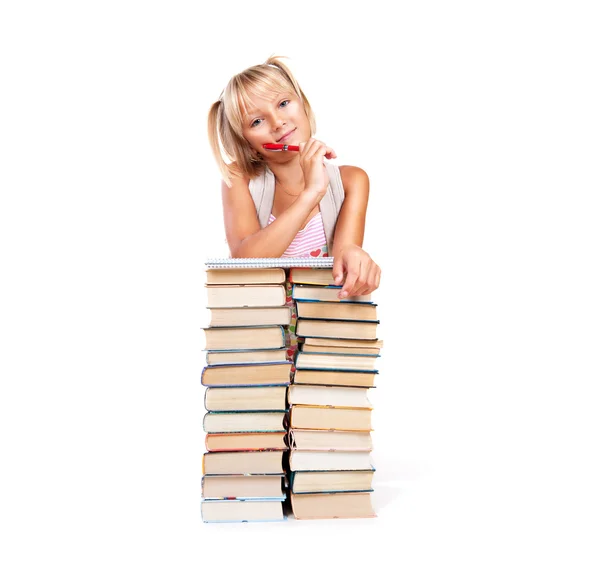 Lächelndes Schulmädchen mit Bücherstapel. — Stockfoto