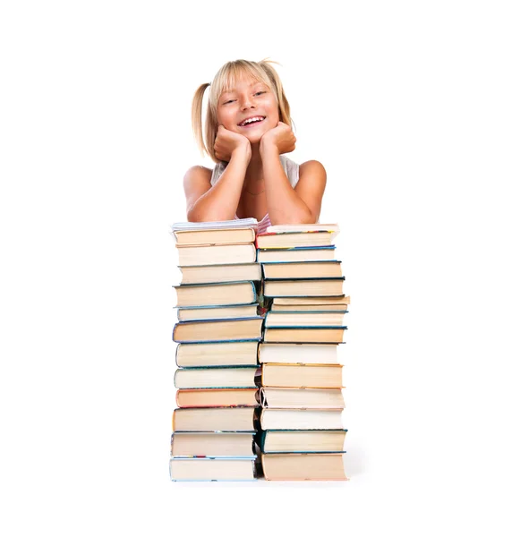 Lächelndes Schulmädchen mit Bücherstapel. — Stockfoto