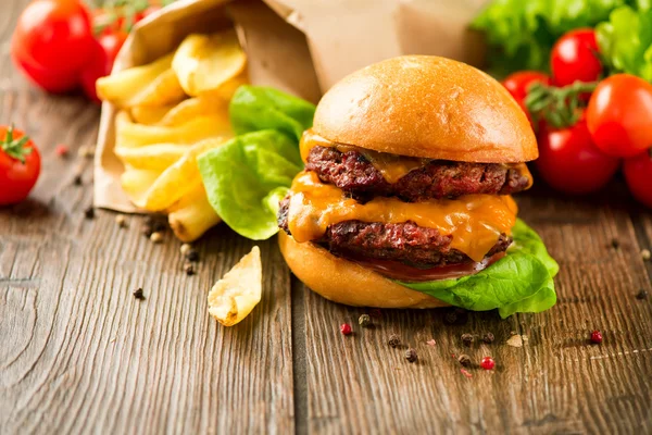 Hamburger with fries on  table — Stock Photo, Image