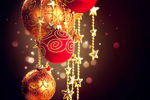 Hanging Christmas baubles and garland — Stock Photo, Image