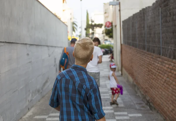 Teenager moves behind group of people — Stock Photo, Image