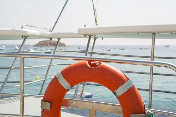 Lifebuoy on a yacht side — Stock Photo, Image