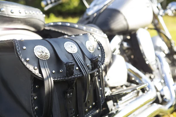 Rear part of motorcycle. Black leather bag. — Stock Photo, Image