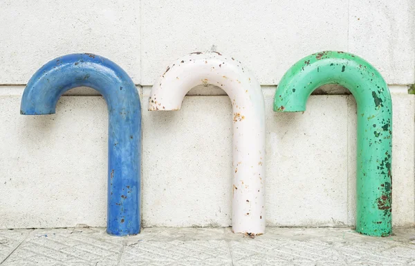 Metal rusty multicolored vintage ventilation pipes on parking sp — Stock Photo, Image