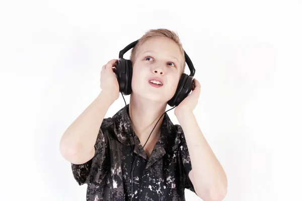 Teenager listening music with headphones, isolated on pure white. — Stock Photo, Image