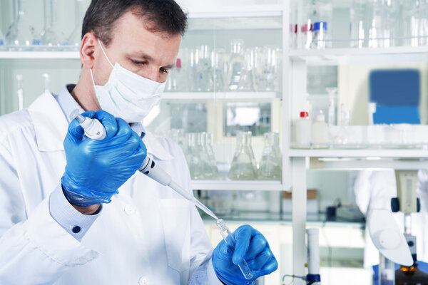 Male researcher at his workplace in the laboratory.