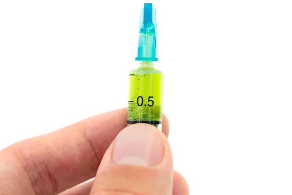 Syringe with the vaccine in hand  - Stock Image — Stock Photo, Image