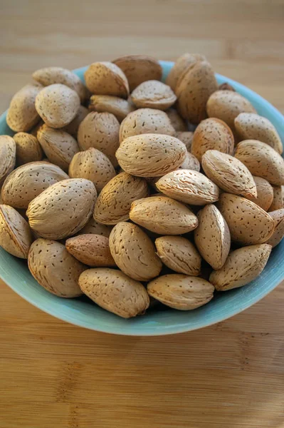 Almonds Table Hard Nutshells Group Dry Ripened Fruits Blue Bowl — Stock Photo, Image