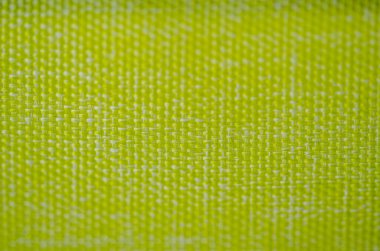 Sarı kumaş arka plan, desenli bir yüzey