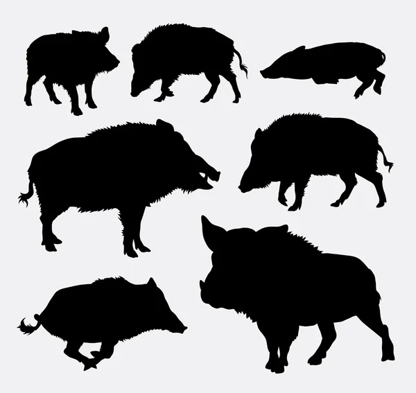 Wild boar silhouettes — Stockvector