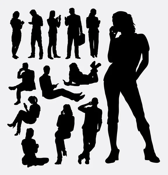 Male and female people with mobile phone silhouettes — Stok Vektör