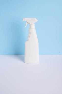 Bottle spray stain remover. isolated on blue background. High quality photo