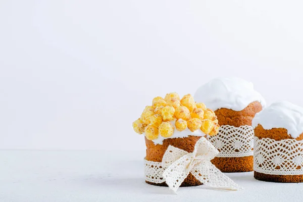 Easter cake decorative popcorn and elegant ribbons on a white background. place for text. High quality photo