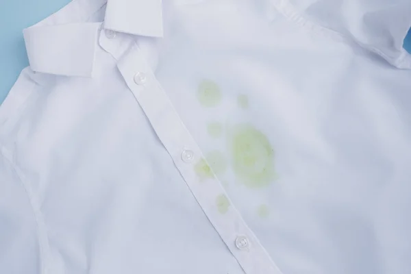 Close up stained white T-shirt. Cleaning concept. High quality photo