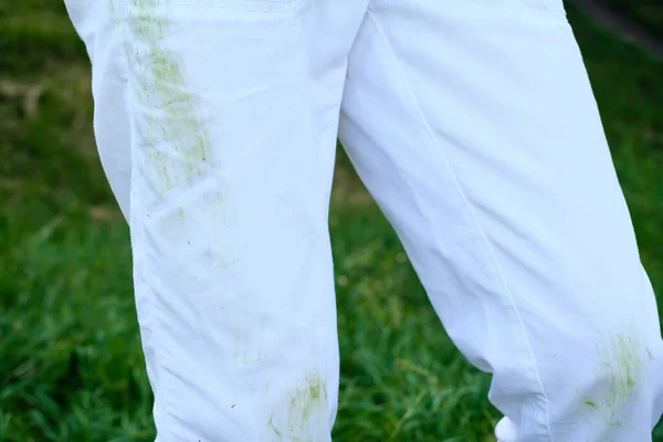 Dirty grass stains on casual clothes. daily life dirty stain for wash and clean concept. High quality photo