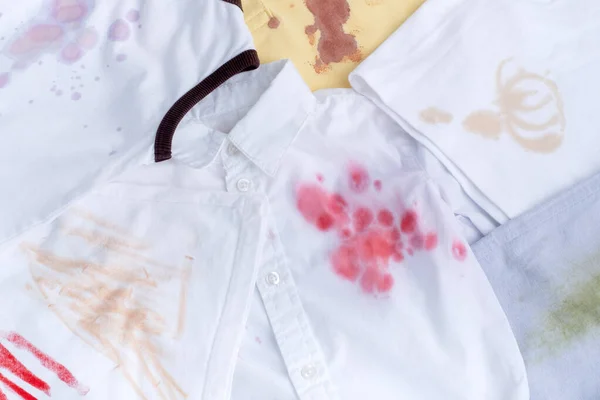 Set of dirty stained clothes. top view. dirt stains for cleaning and washing concept. High quality photo