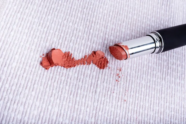 Dirty stains of lipstick on the couch. dirty stains in daily life for cleaning concept. High quality photo