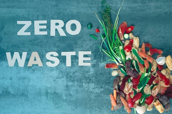 Garbage sorting. Organic food waste from vegetables ready for recycling and to compost with the word zero waste. Environmentally responsible behavior, ecology concept. Flat lay. High quality photo