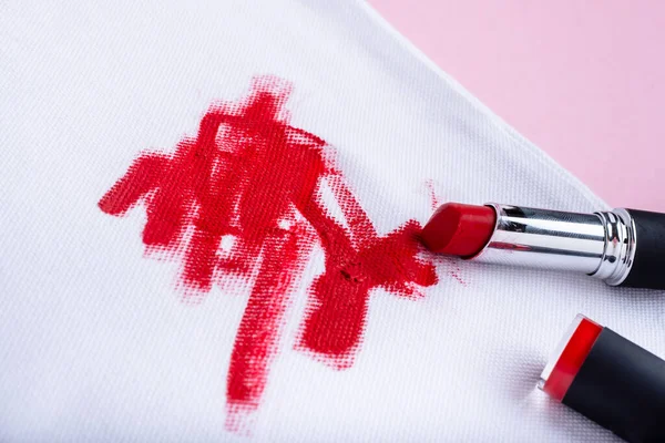 Remove the lipstick stains from clothing. High quality photo