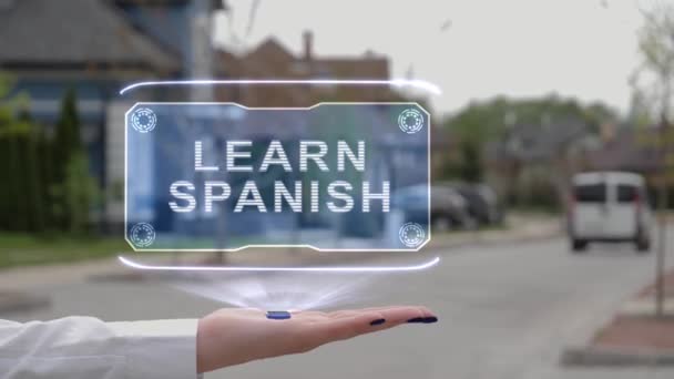 Női kéz bemutató hologram Ismerje meg a spanyol — Stock videók