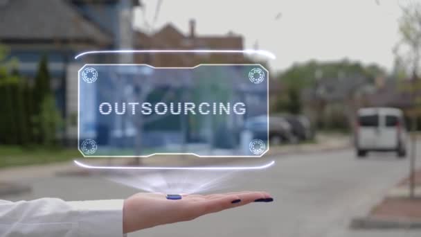 Weibliche Hand zeigt Hologramm Outsourcing — Stockvideo