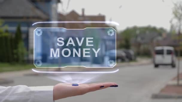 Main féminine montrant l'hologramme Économisez de l'argent — Video