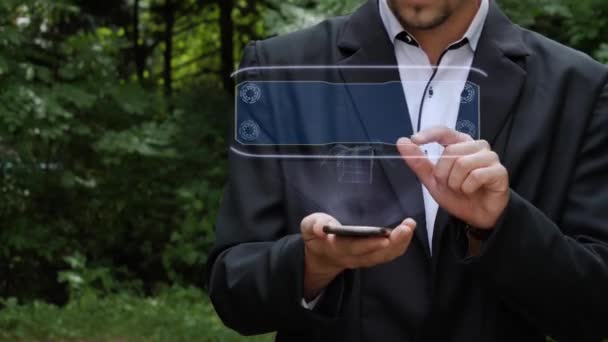 Empresario utiliza holograma con caja de regalo — Vídeos de Stock