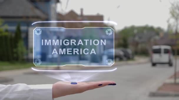 Γυναικείο χέρι που δείχνει ολόγραμμα Μετανάστευση Αμερική — Αρχείο Βίντεο