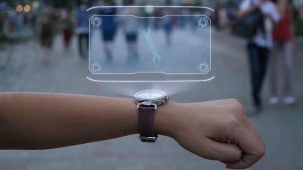 Vrouwelijke hand met hologram moersleutel — Stockvideo