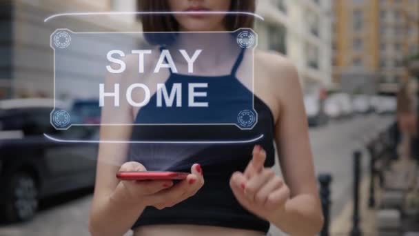 Young adult interacts hologram Stay Home — Stock Video