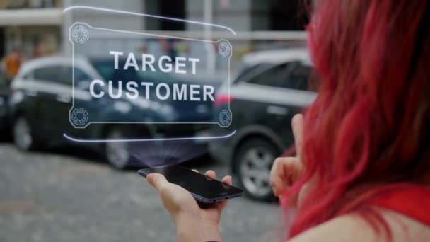 Redhead woman interacts HUD Target Customer — Stockvideo